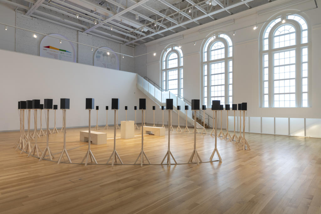Jace Clayton's installation of 40 speakers on simple wooden stands