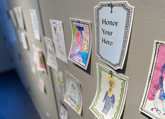 Artwork pinned up in the Big Ideas Studio from the Honor your Hero activity.