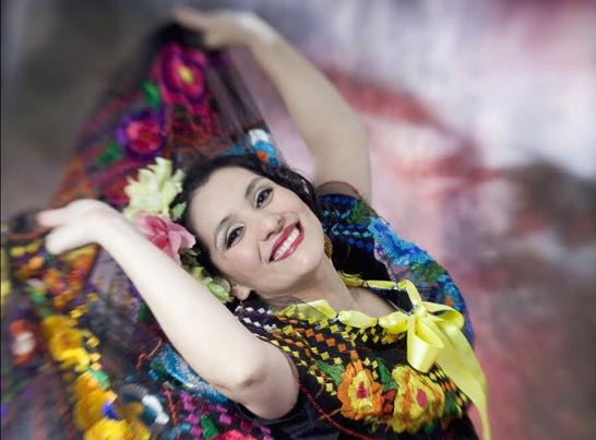 Image of musician Veronica Robles dancing.