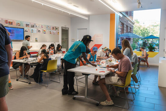Museum visitors engaging with hands-on activities in the Barkan Family Big Ideas Studio