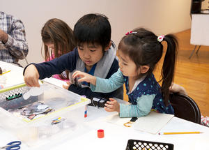 Two children making artwork.