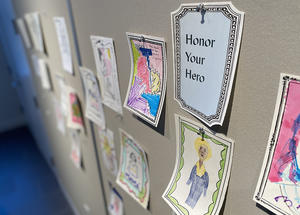 Artwork pinned up in the Big Ideas Studio from the Honor your Hero activity.