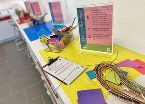 Artmaking materials set up for a drop-in design challenge activity.