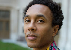 portrait of Jace Clayton wearing a brightly colored and patterned shirt