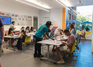 Museum visitors engaging with hands-on activities in the Barkan Family Big Ideas Studio