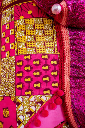 Detail showing patterned capulana fabric in pinks, yellows, and reds on Joana Vasconselos sculpture