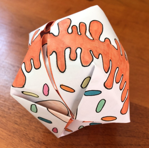 Folded paper balloon covered with colorful patterns