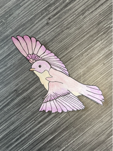 Pink and purple cut out drawing of a bluebird in flight